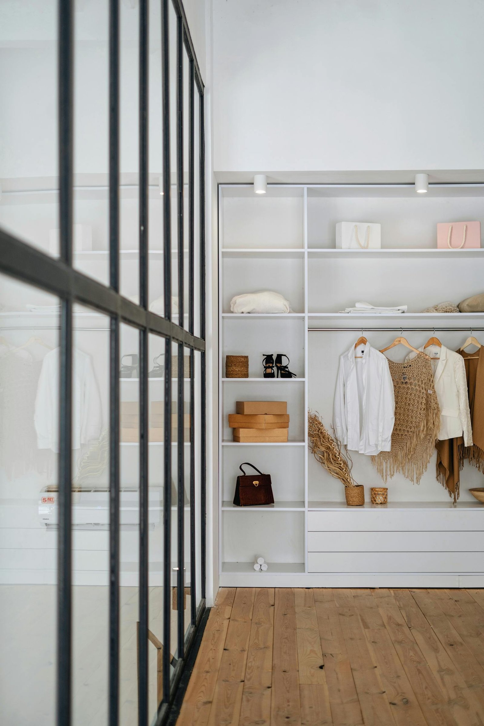 Explore a modern wardrobe setup in a minimalist apartment interior with organized shelves and trendy decor.